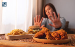 Image of a person saying no to food